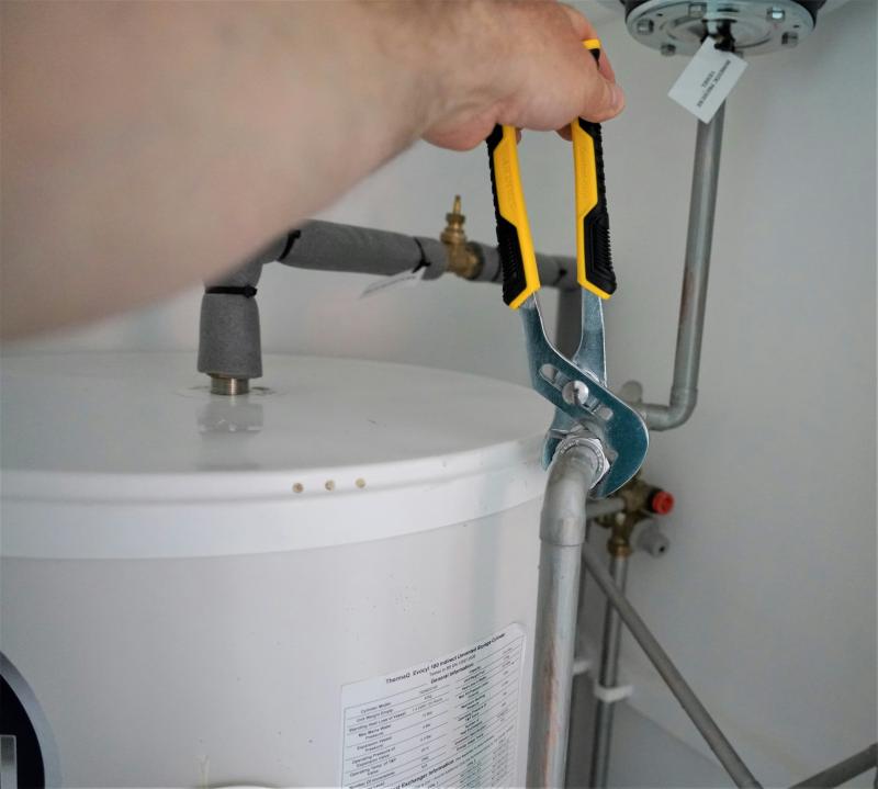  Licensed plumber performing water heater repair in Las Vegas, NV